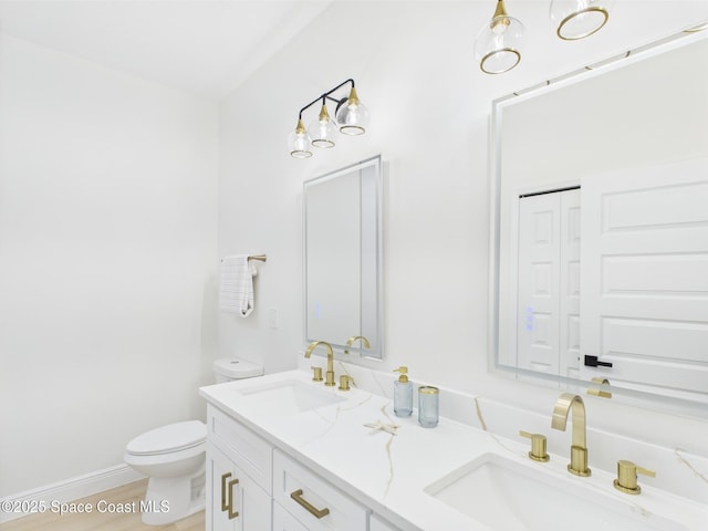 8116 97th Ct, Vero Beach, FL 32967 - bathroom with toilet and double vanity