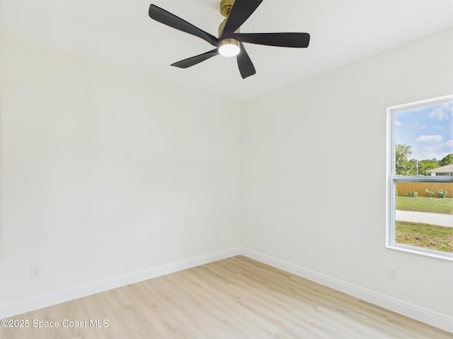 8116 97th Ct, Vero Beach, FL 32967 - unfurnished room with light wood-style flooring, plenty of natural light, and baseboards