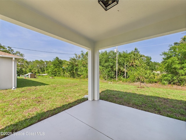 8116 97th Ct, Vero Beach, FL 32967 - view of patio / terrace featuring view of scattered trees