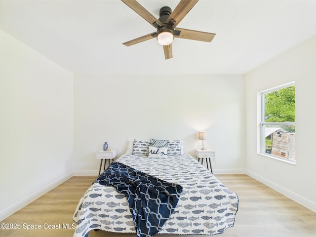 8126 97th Ave, Vero Beach, FL 32967 - bedroom featuring light wood-style floors, baseboards, and a ceiling fan