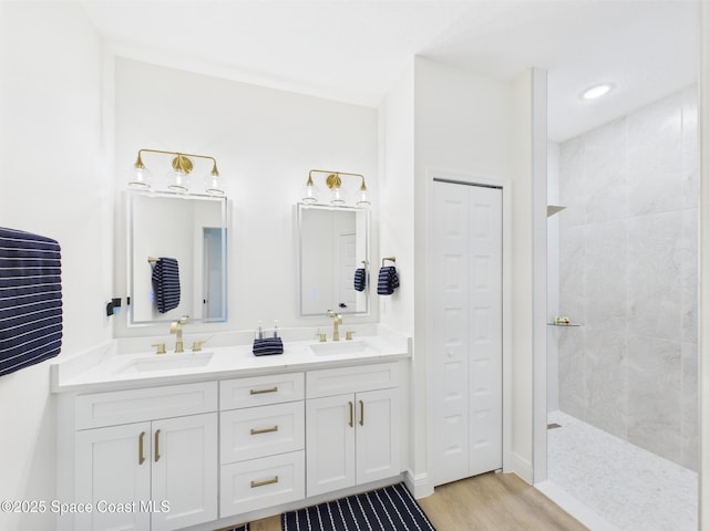 8126 97th Ave, Vero Beach, FL 32967 - full bath with walk in shower, double vanity, wood finished floors, and a closet