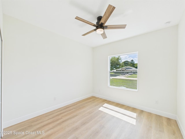 8126 97th Ave, Vero Beach, FL 32967 - unfurnished room featuring light wood finished floors, baseboards, and ceiling fan