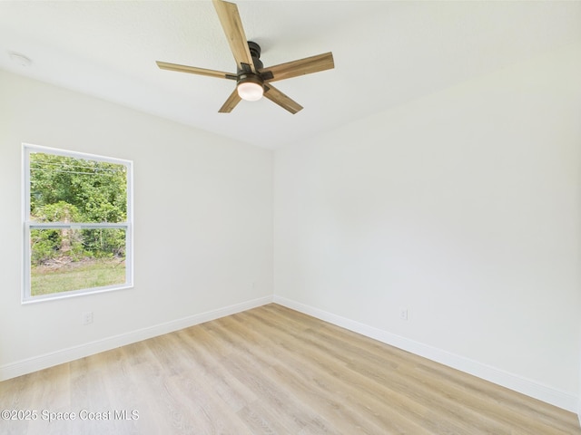 8126 97th Ave, Vero Beach, FL 32967 - spare room featuring light wood-style flooring, a ceiling fan, baseboards, and a smoke detector