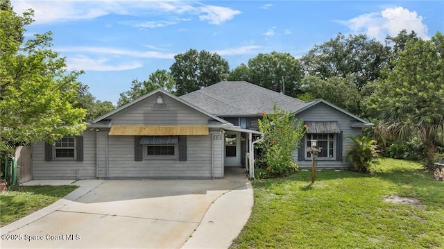 8516 99th Ct, Vero Beach, FL 32967 - view of front of property with a front yard and concrete driveway