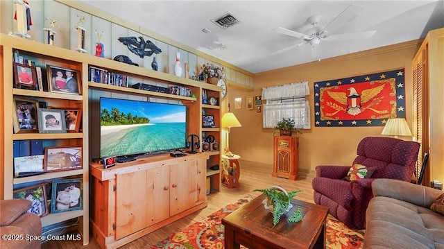 8516 99th Ct, Vero Beach, FL 32967 - living room featuring wood finished floors, ceiling fan, and crown molding