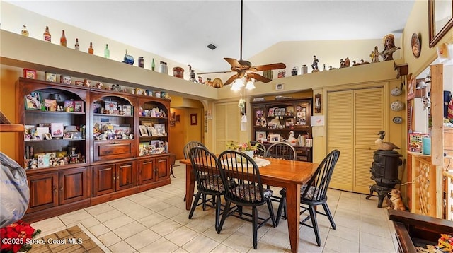 8516 99th Ct, Vero Beach, FL 32967 - dining room featuring light tile patterned floors, vaulted ceiling, ceiling fan, and arched walkways
