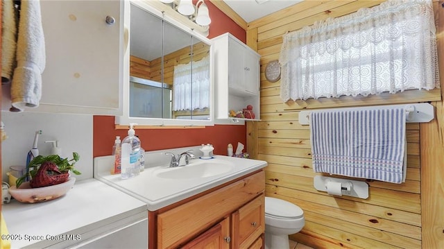 8516 99th Ct, Vero Beach, FL 32967 - full bathroom featuring vanity, toilet, and a shower with door