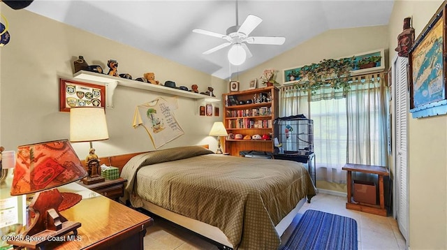 8516 99th Ct, Vero Beach, FL 32967 - bedroom with vaulted ceiling, light tile patterned floors, and a ceiling fan