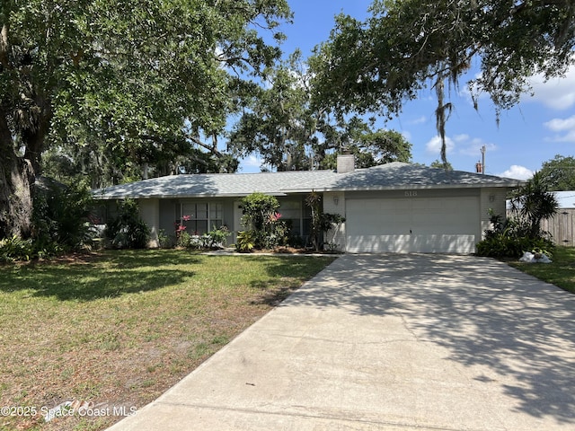 518 Homestead Ave NE, Palm Bay, FL 32907 - ranch-style house featuring a front yard, an attached garage, concrete driveway, and a chimney