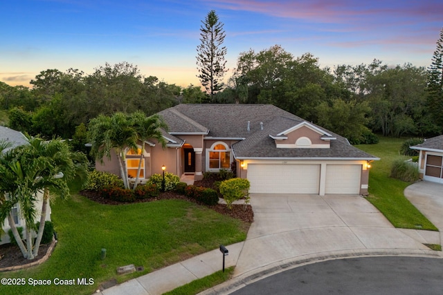 1197 Acappella Dr, Melbourne, FL 32940 - view of front of property with stucco siding, an attached garage, concrete driveway, and a front yard