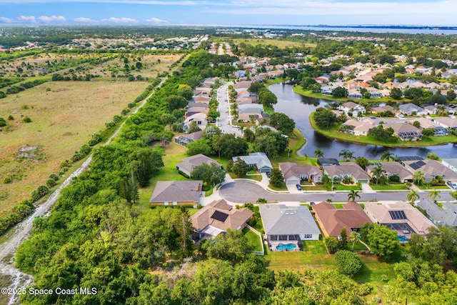 1197 Acappella Dr, Melbourne, FL 32940 - aerial view of property and surrounding area with nearby suburban area and a nearby body of water