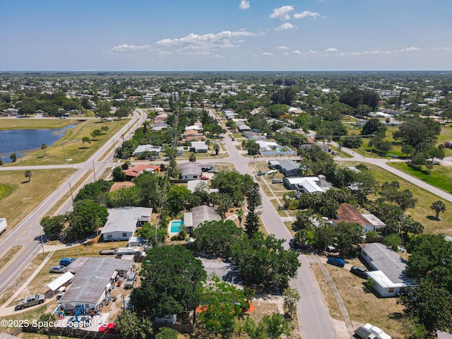 aerial view of property's location with a nearby body of water
