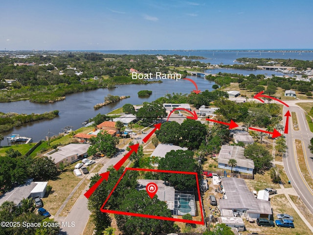 aerial view of property and surrounding area with a large body of water and property boundaries highlighted