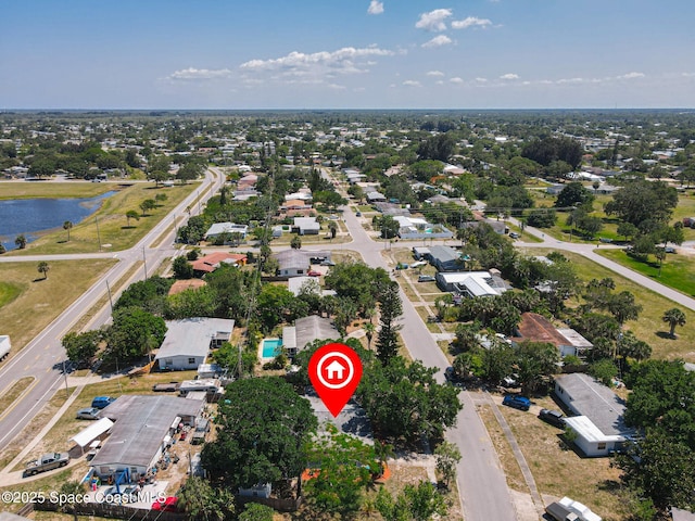 aerial view of property's location featuring a large body of water