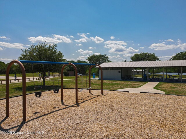 community playground featuring a lawn