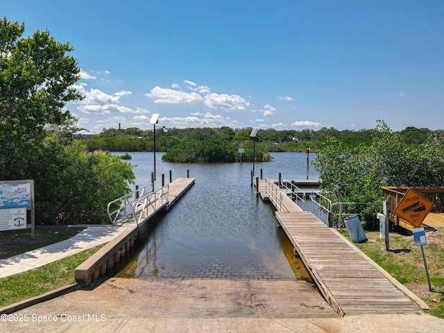 dock area featuring a boat ramp and a water view