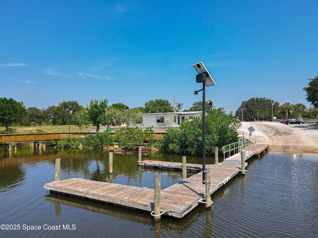 dock area featuring a water view