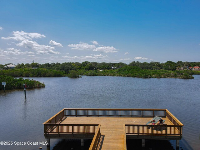 dock featuring a deck with water view