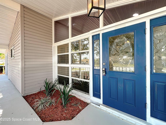 doorway to property with a porch