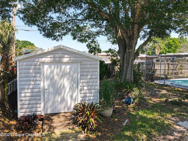 view of shed with a fenced backyard