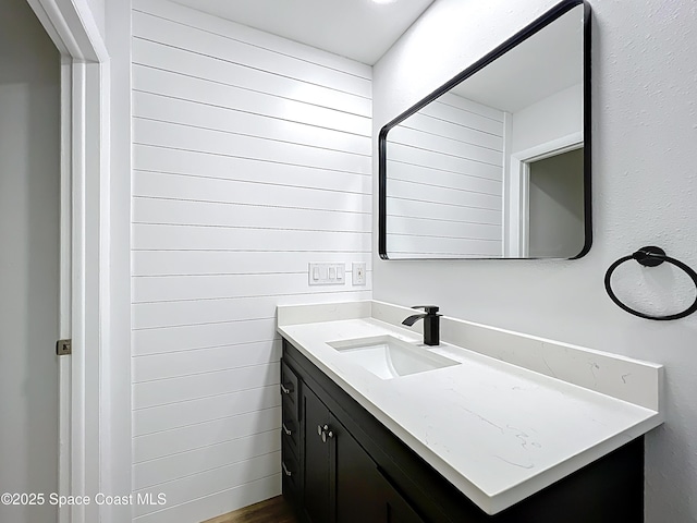 bathroom featuring vanity and wood finished floors