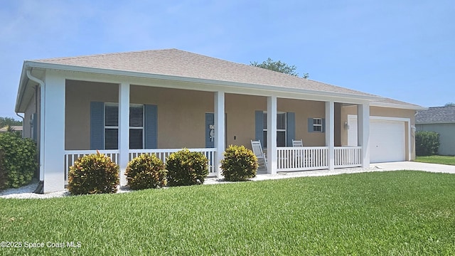 5290 Cinnamon Fern Blvd, Cocoa, FL 32927 - view of front of home with a porch, an attached garage, concrete driveway, stucco siding, and a front lawn
