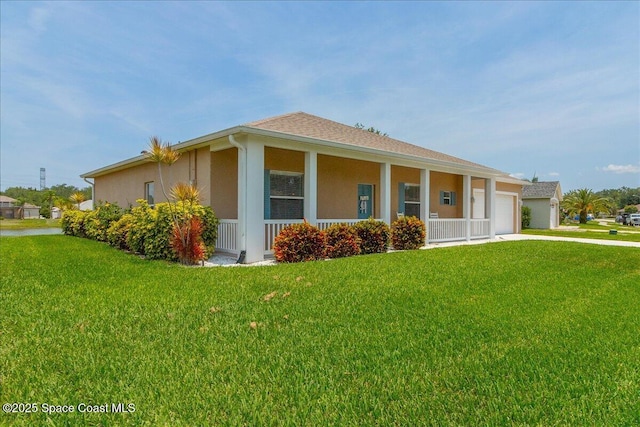 5290 Cinnamon Fern Blvd, Cocoa, FL 32927 - view of front facade with driveway, stucco siding, a garage, a front yard, and a porch