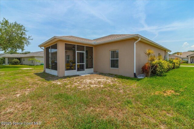 5290 Cinnamon Fern Blvd, Cocoa, FL 32927 - back of house featuring a sunroom, a yard, and stucco siding
