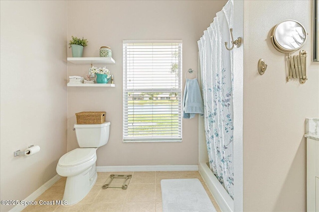 5290 Cinnamon Fern Blvd, Cocoa, FL 32927 - full bath with toilet, plenty of natural light, tile patterned floors, and a shower with curtain
