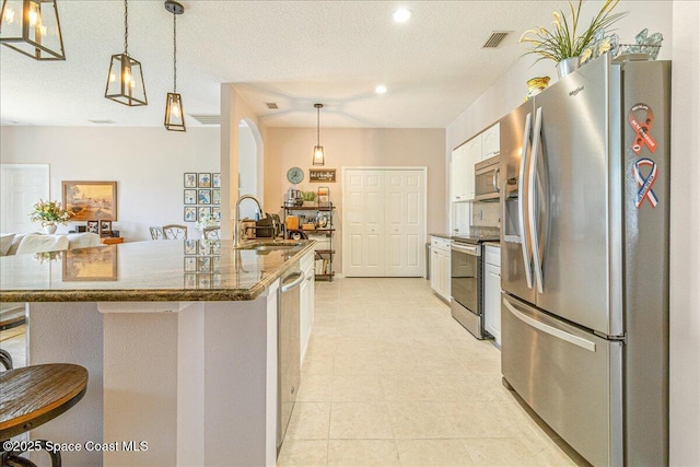 5290 Cinnamon Fern Blvd, Cocoa, FL 32927 - kitchen featuring stainless steel appliances, a sink, recessed lighting, decorative light fixtures, and white cabinetry