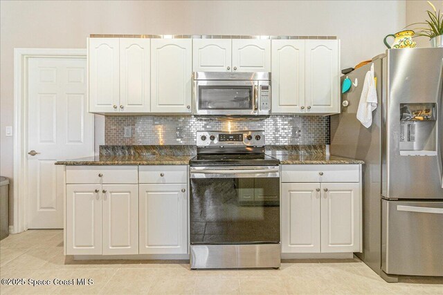 5290 Cinnamon Fern Blvd, Cocoa, FL 32927 - kitchen with stainless steel appliances, white cabinets, and backsplash