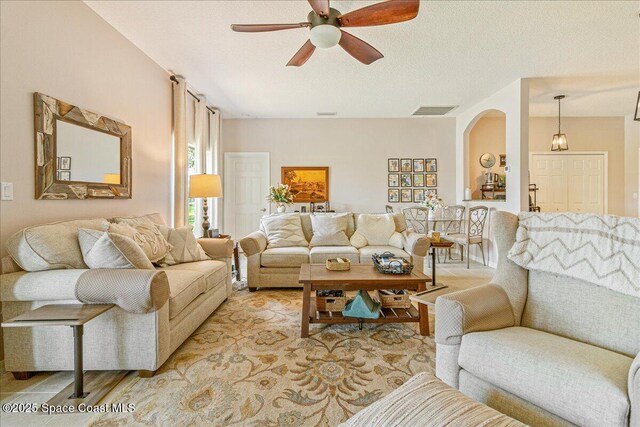 5290 Cinnamon Fern Blvd, Cocoa, FL 32927 - living area with ceiling fan and arched walkways