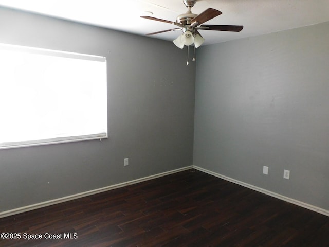 1581 Charles Blvd NE, Palm Bay, FL 32907 - spare room with wood finished floors, a ceiling fan, and baseboards