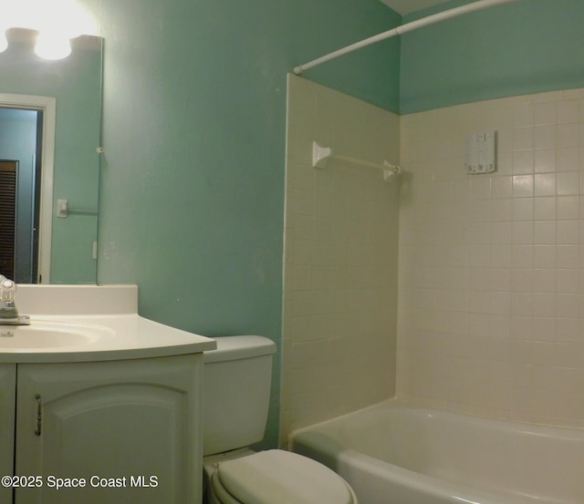 1581 Charles Blvd NE, Palm Bay, FL 32907 - bathroom featuring toilet, vanity, and tub / shower combination