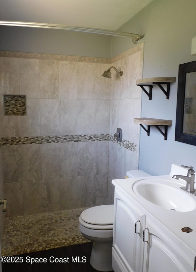 1581 Charles Blvd NE, Palm Bay, FL 32907 - full bath with vanity, a tile shower, and toilet