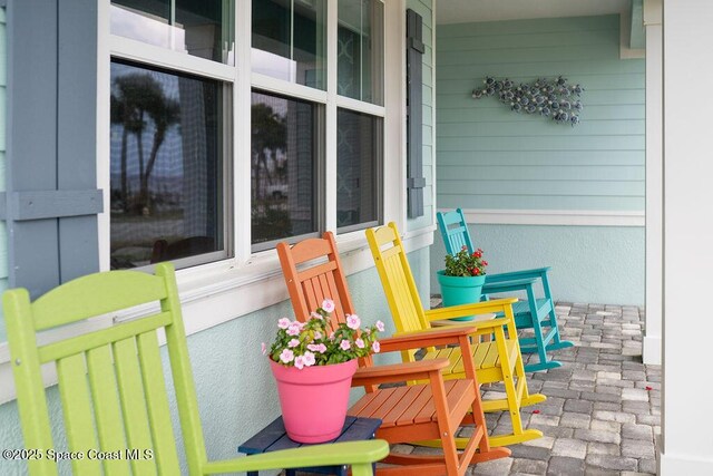 5250 Riveredge Dr, Titusville, FL 32780 - view of patio / terrace featuring covered porch