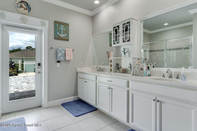 5250 Riveredge Dr, Titusville, FL 32780 - full bathroom with ornamental molding, a shower stall, double vanity, tile patterned flooring, and recessed lighting