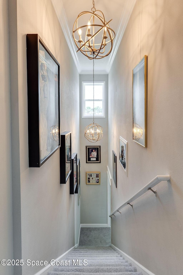 5250 Riveredge Dr, Titusville, FL 32780 - foyer featuring a chandelier, ornamental molding, carpet, and stairs