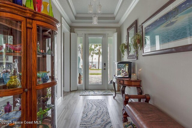 5250 Riveredge Dr, Titusville, FL 32780 - entryway with plenty of natural light, wood finished floors, crown molding, and a raised ceiling