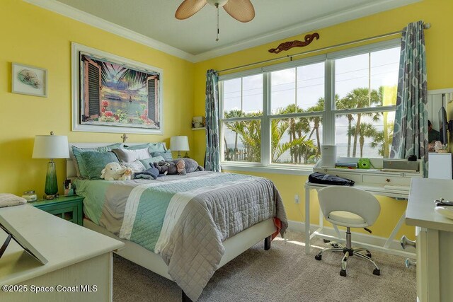 5250 Riveredge Dr, Titusville, FL 32780 - carpeted bedroom featuring crown molding, baseboards, and ceiling fan