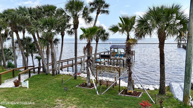 5250 Riveredge Dr, Titusville, FL 32780 - dock area with a lawn and a water view