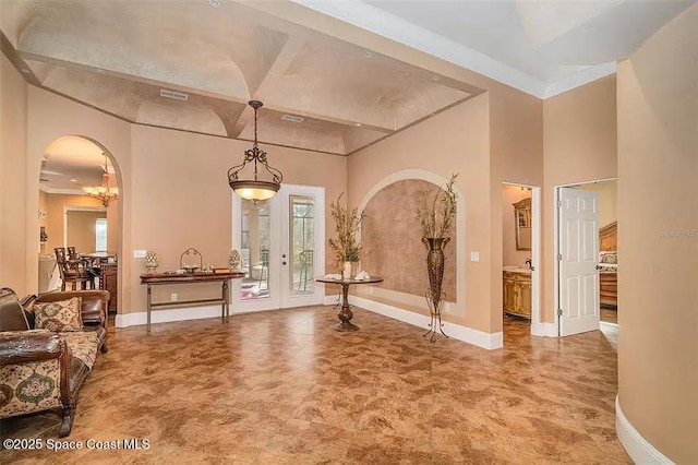 20880 Reynolds Pkwy, Orlando, FL 32833 - foyer featuring baseboards, arched walkways, and crown molding