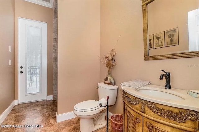 20880 Reynolds Pkwy, Orlando, FL 32833 - bathroom with toilet, vanity, baseboards, and ornamental molding