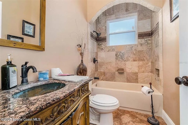 20880 Reynolds Pkwy, Orlando, FL 32833 - bathroom featuring toilet, vanity, shower / bathtub combination, and tile patterned flooring