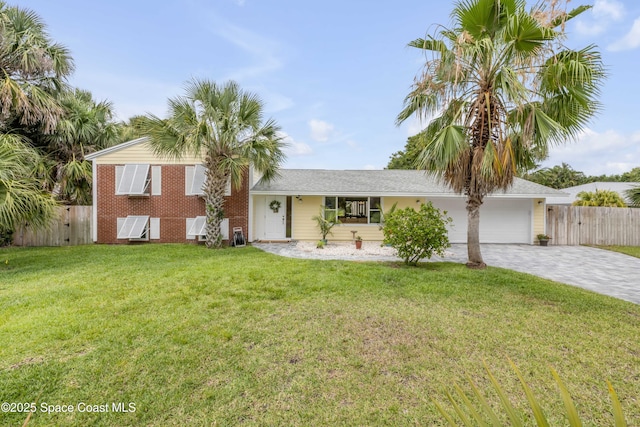 2007 Oak St, Melbourne Beach, FL 32951 - tri-level home featuring decorative driveway and a garage