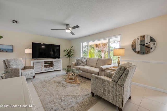 2007 Oak St, Melbourne Beach, FL 32951 - tiled living area with ceiling fan and baseboards