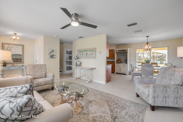 2007 Oak St, Melbourne Beach, FL 32951 - living area featuring a chandelier, light tile patterned floors, and ceiling fan