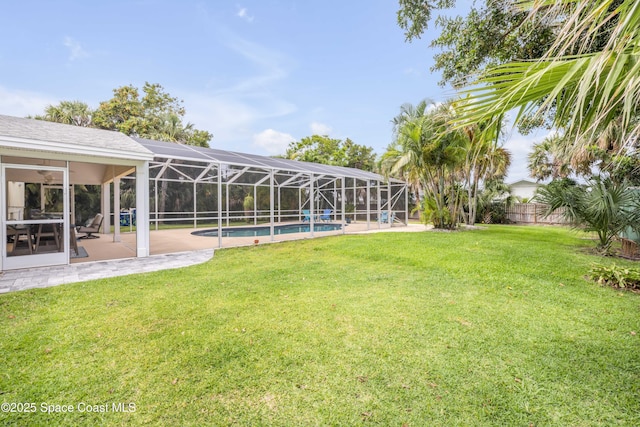 2007 Oak St, Melbourne Beach, FL 32951 - view of yard with an outdoor pool, a patio, and a lanai