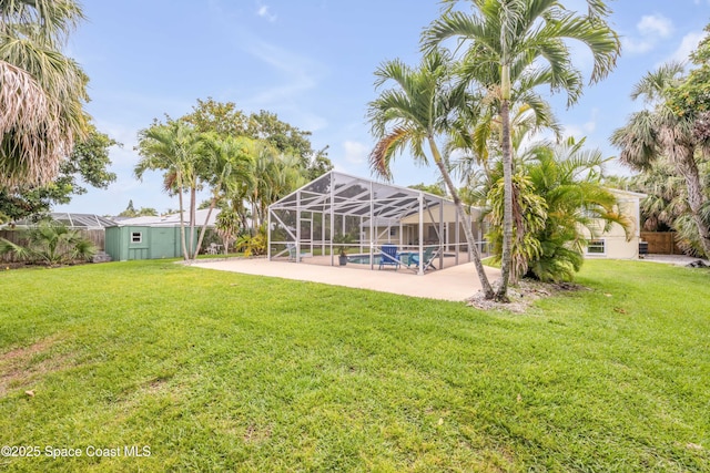 2007 Oak St, Melbourne Beach, FL 32951 - view of green lawn with a patio, an outdoor pool, and a lanai