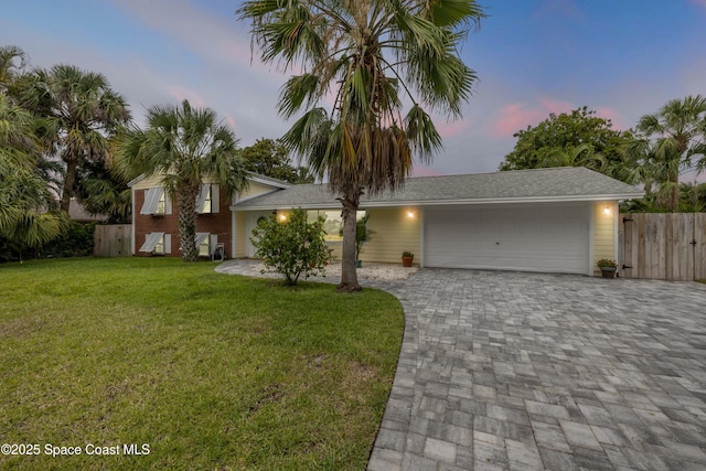 2007 Oak St, Melbourne Beach, FL 32951 - view of front of home with a garage and driveway